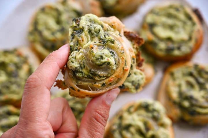 Delicious spinach-stuffed mushrooms with melted cheese, perfect for healthy snacking or appetizers.