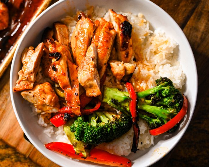 Honey garlic chicken thighs over rice with veggies