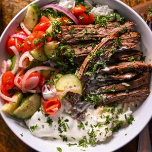 Mediterranean steak and rice bowls with garlic dill yogurt sauce for athletes